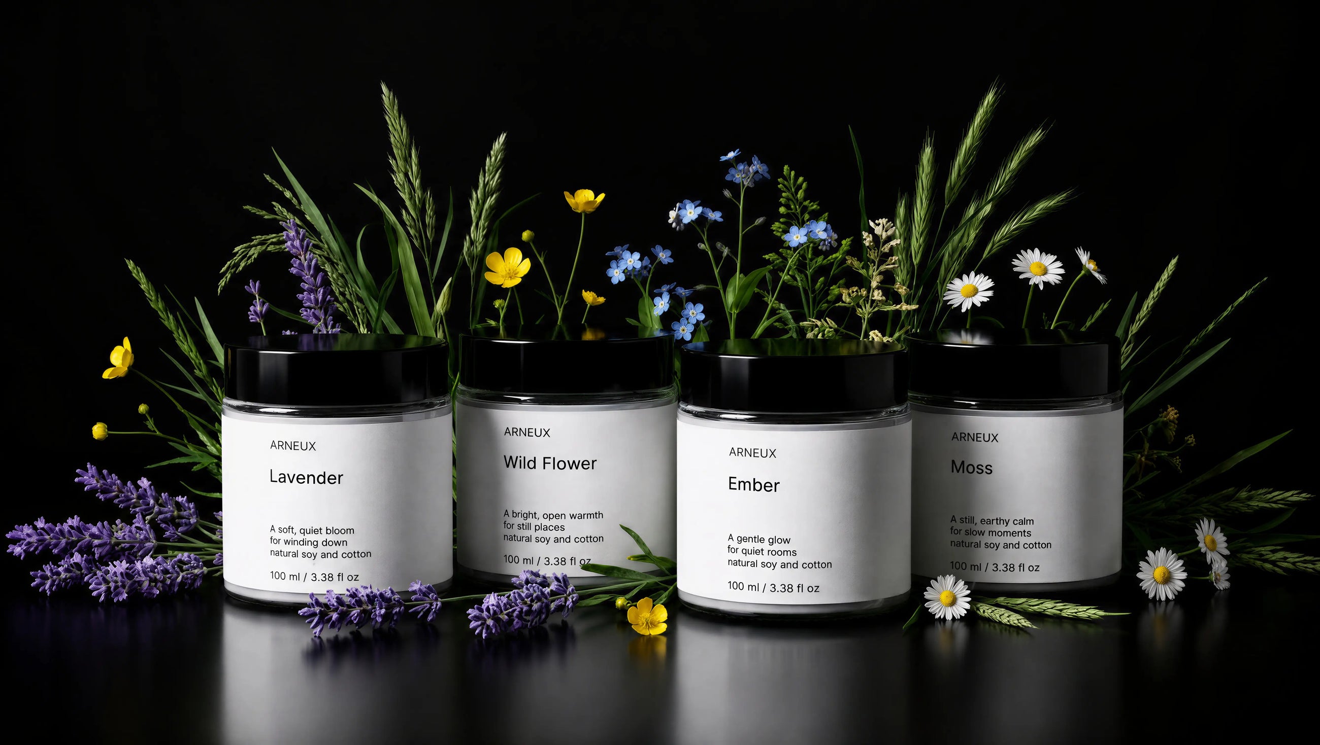 ARNEUX ILLUMINATE candle set with lavender and wild flower botanicals on dark background