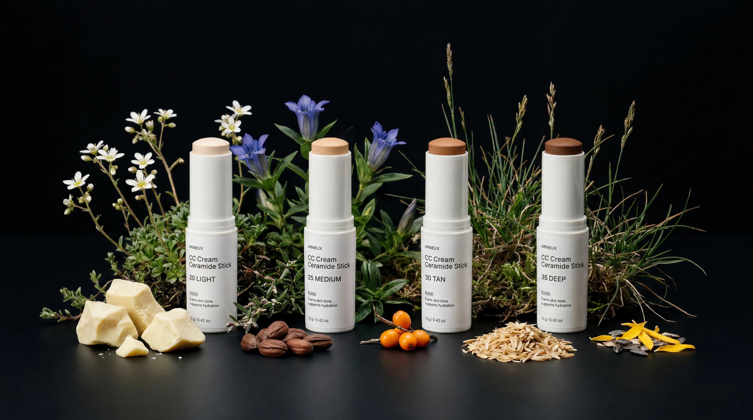All four BLEND ceramide stick shades with cocoa butter, cacao, sea buckthorn and other ingredients on black