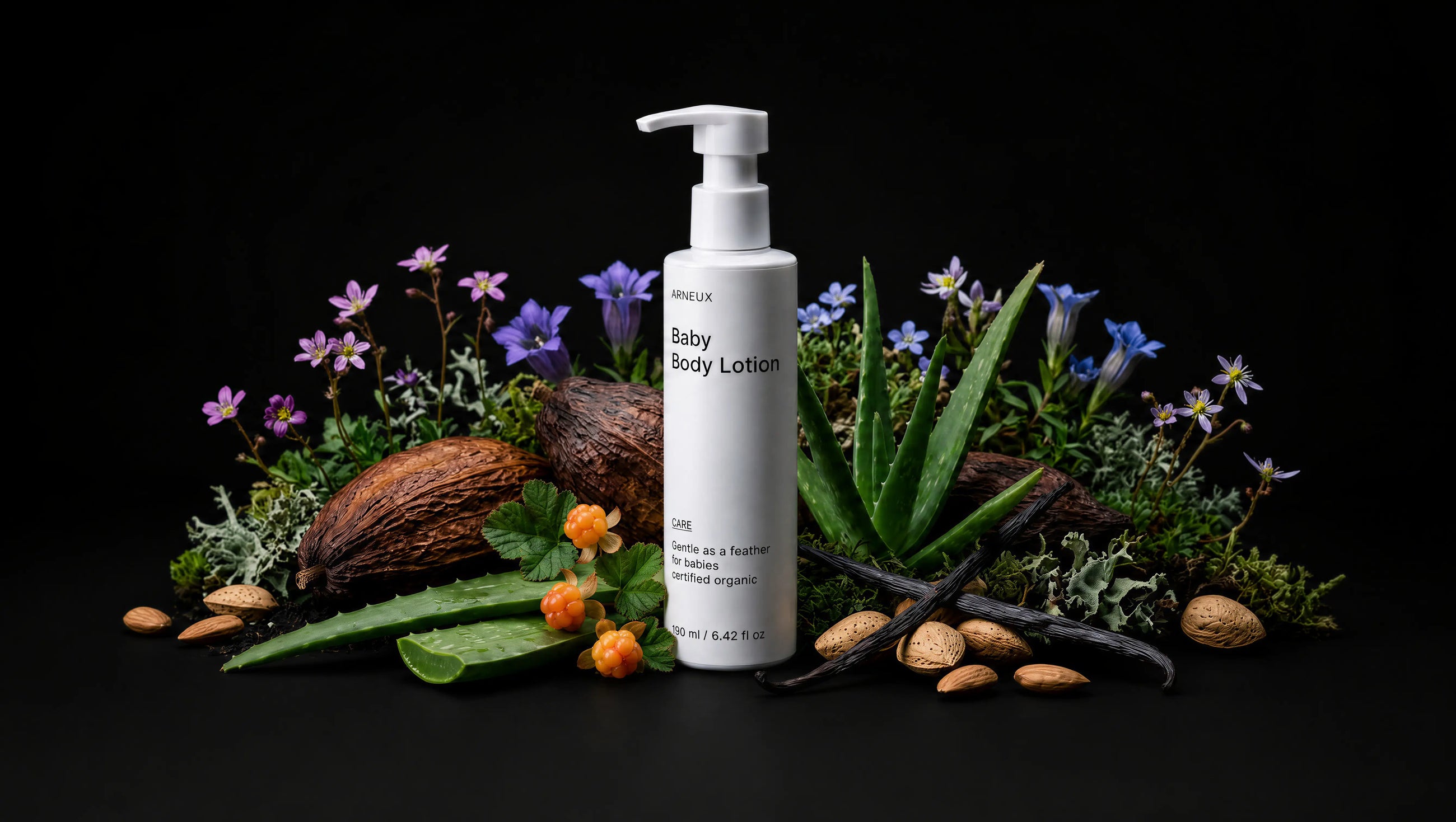 CARE baby body lotion bottle with coconut, aloe vera, purple florals and almonds on black background