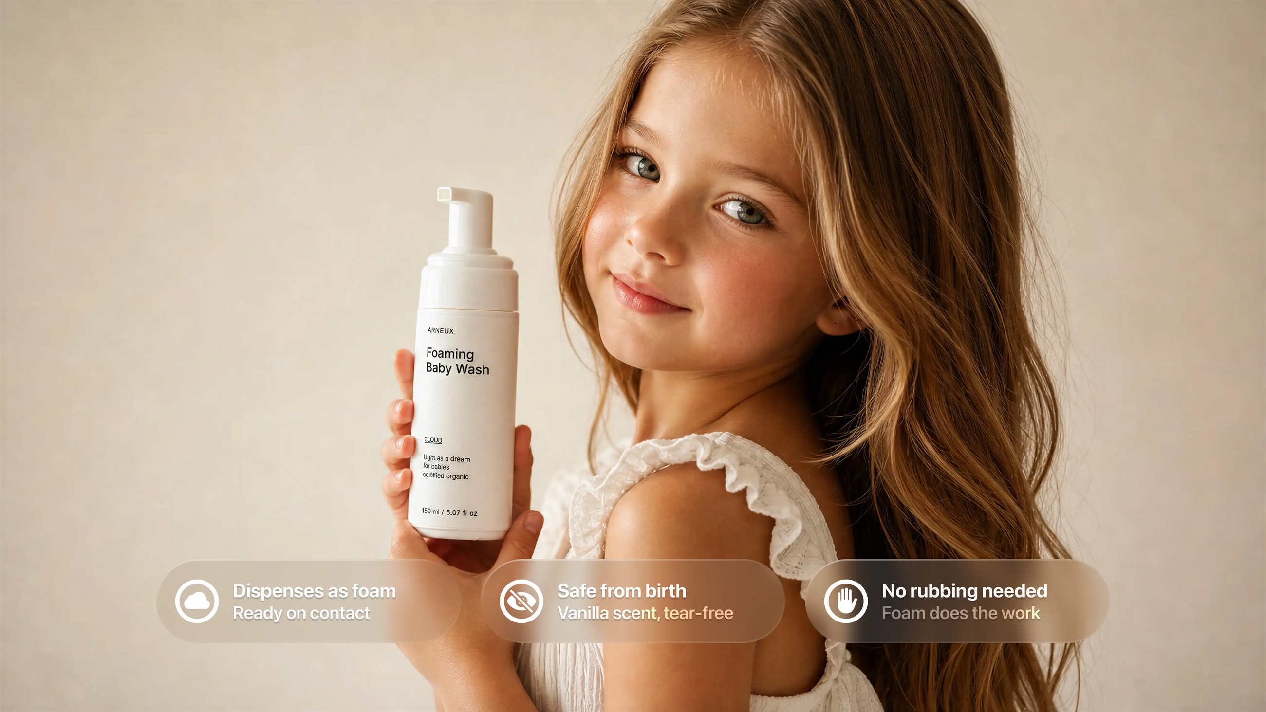 Young girl holding CLOUD foaming baby wash, dispenses as foam safe from birth no rubbing needed callouts