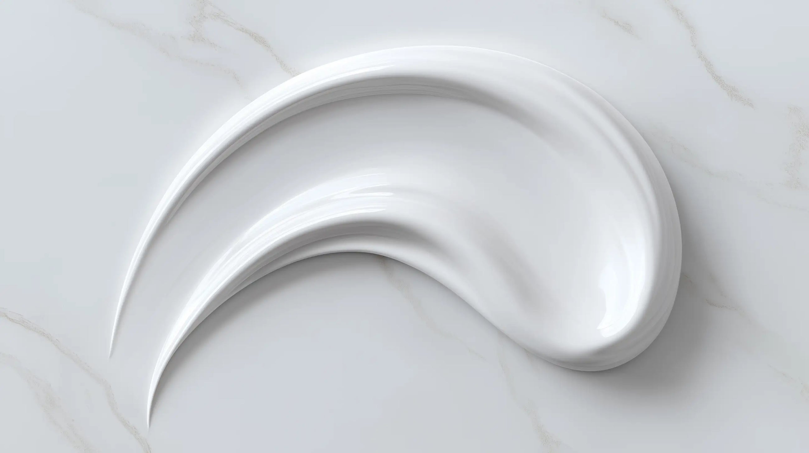 Moisturizing light cream smooth white texture swatch on marble, fast-absorbing matte finish consistency