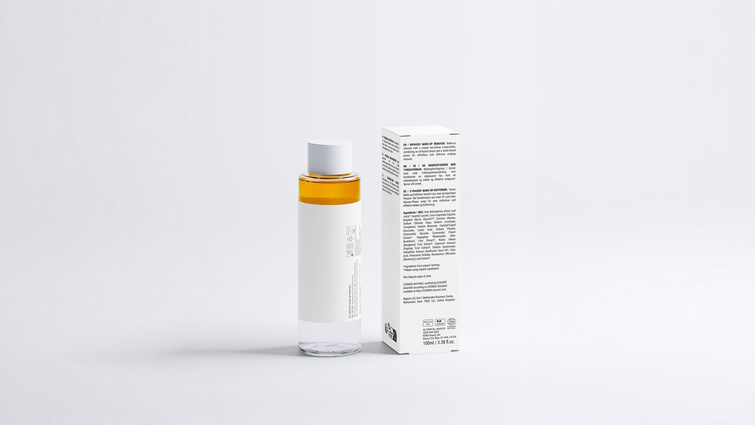 DISSOLVE biphasic makeup remover bottle beside box, side view showing back label text