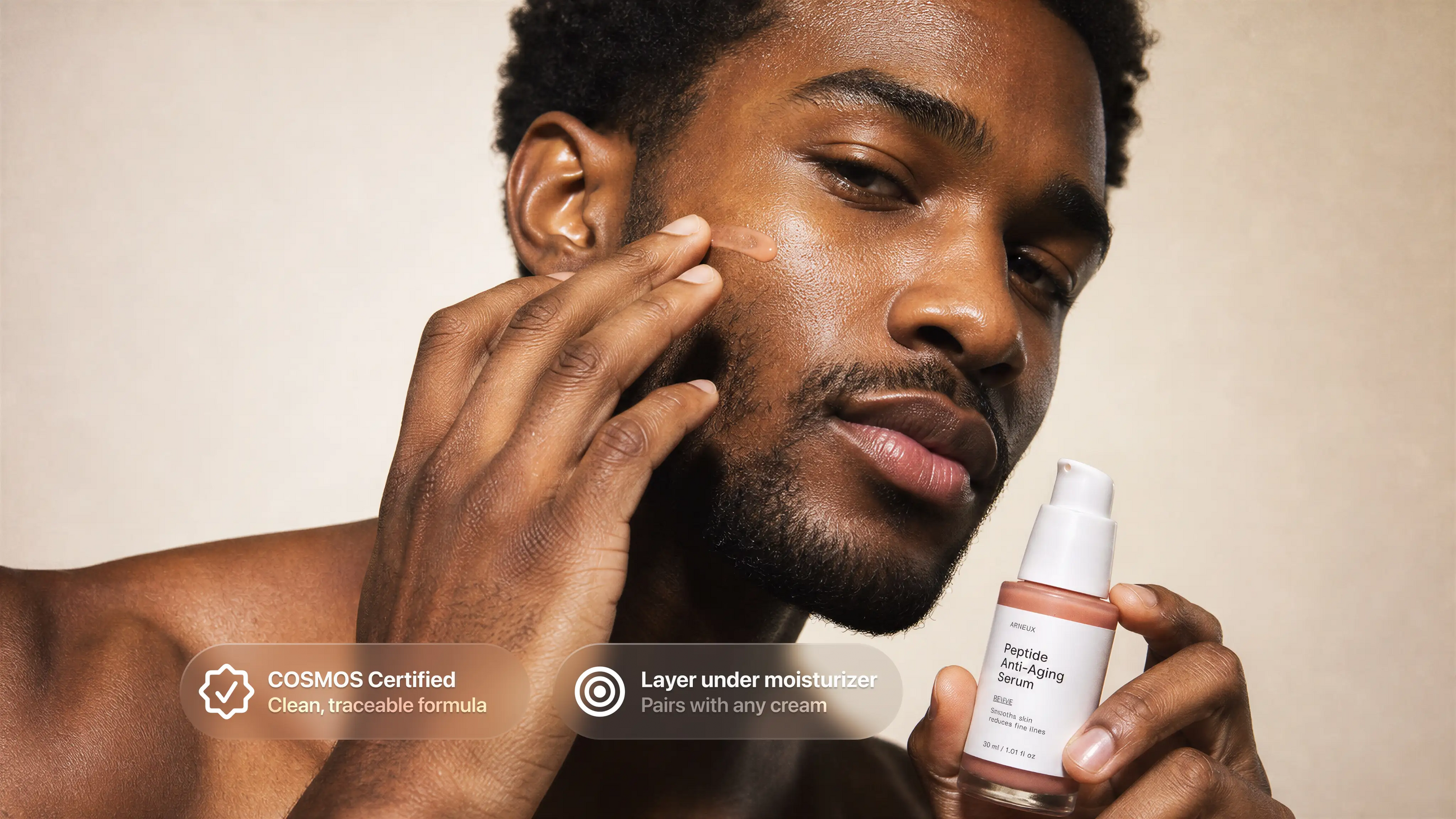 Man pressing peptide anti-aging serum into cheek, COSMOS certified layer under moisturizer callout
