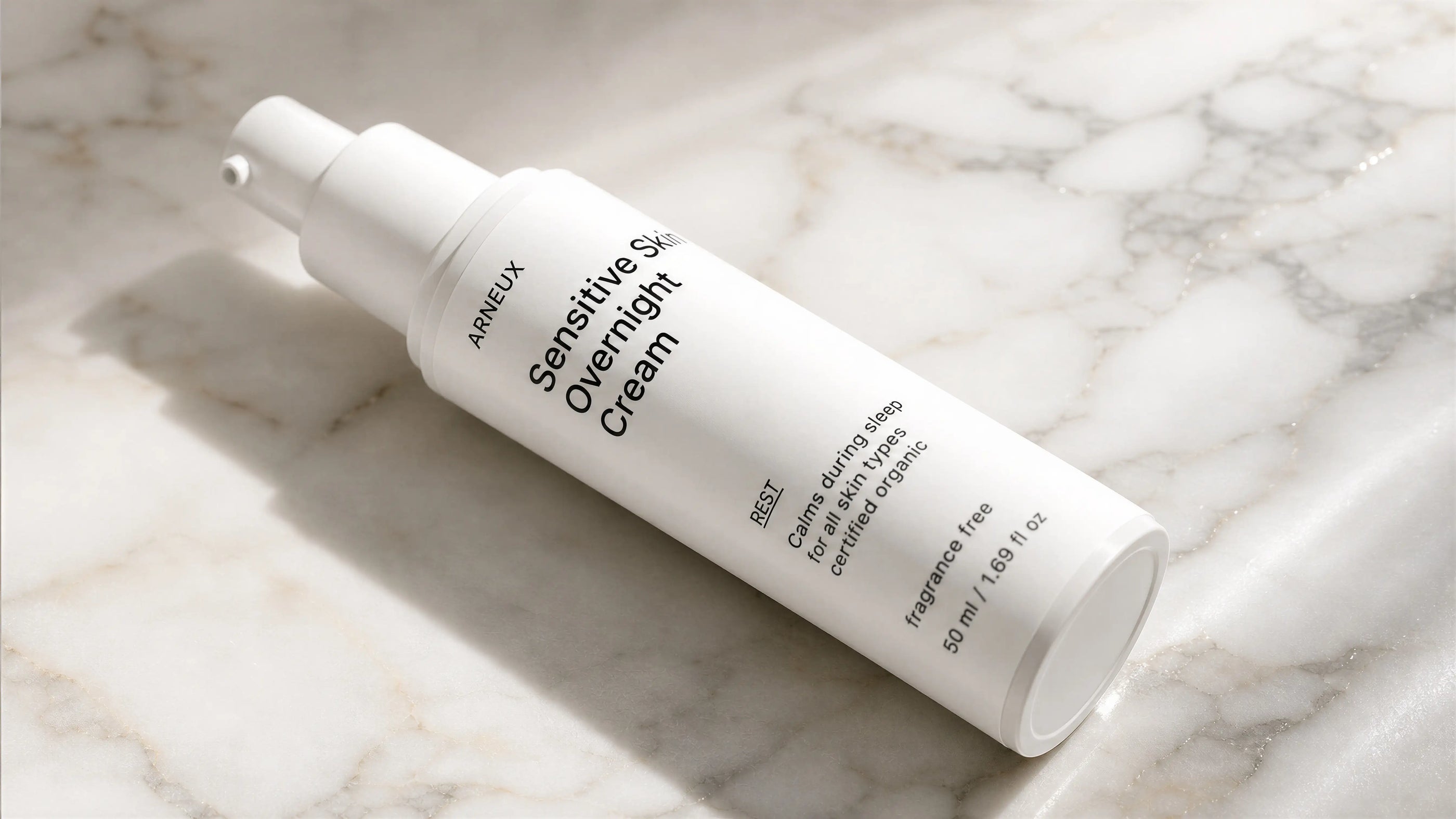 Fragrance-free skincare routine for sensitive skin laid out on a marble stone surface