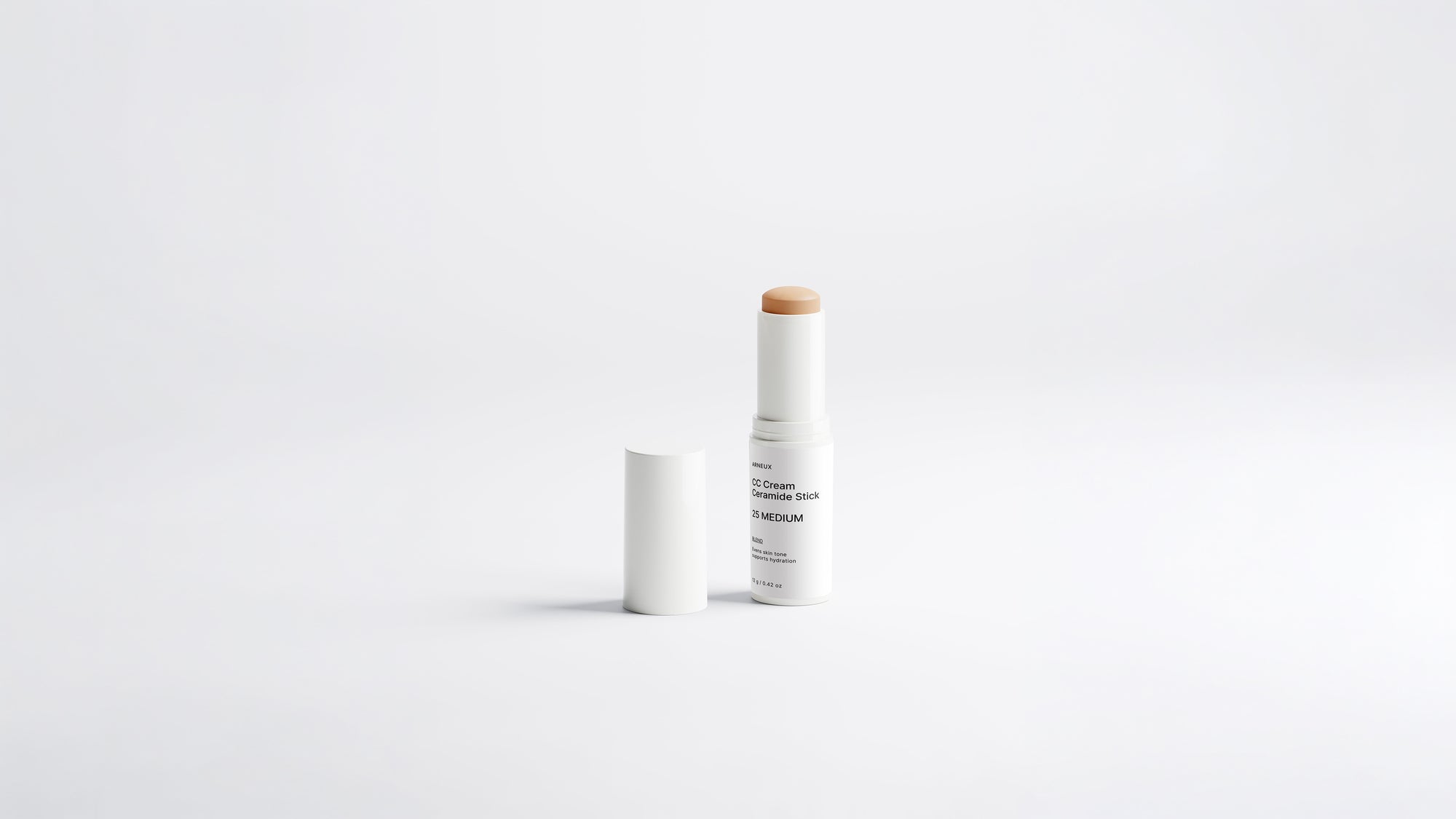 BLEND CC cream ceramide stick shade 25 Medium uncapped on white