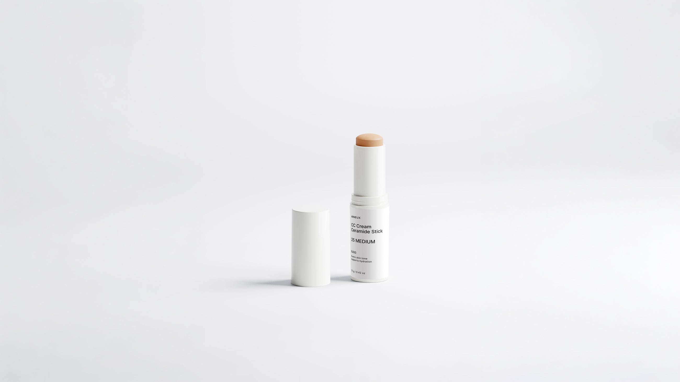 BLEND CC cream ceramide stick shade 25 Medium uncapped on white