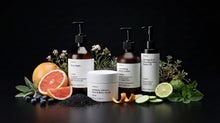 ARNEUX ELEVATE organic body care routine with grapefruit and botanical ingredients on dark background