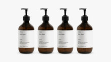 INDULGE The Shower Edit by ARNEUX, four organic body wash scents in amber bottles on white background