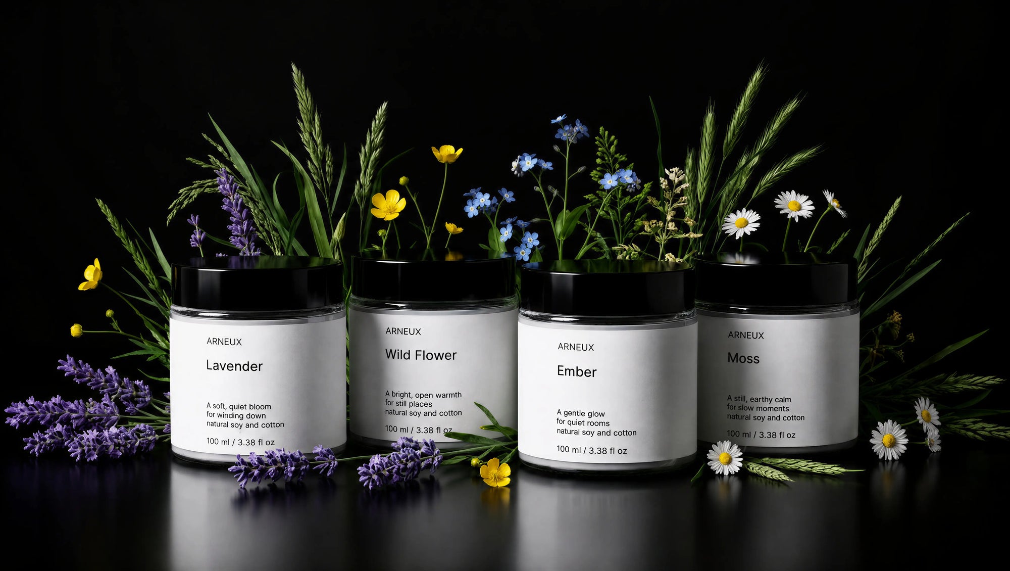 ARNEUX ILLUMINATE candle set with lavender and wild flower botanicals on dark background