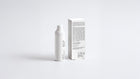 AURA vitamin C serum bottle beside box back panel showing full ingredient list