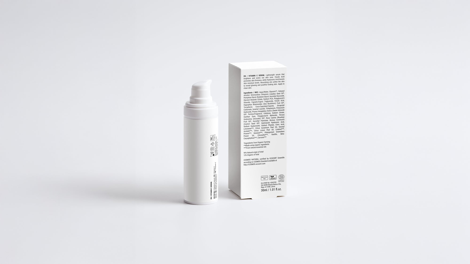 AURA vitamin C serum bottle beside box back panel showing full ingredient list