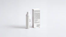 AURA vitamin C serum bottle beside box back panel showing full ingredient list