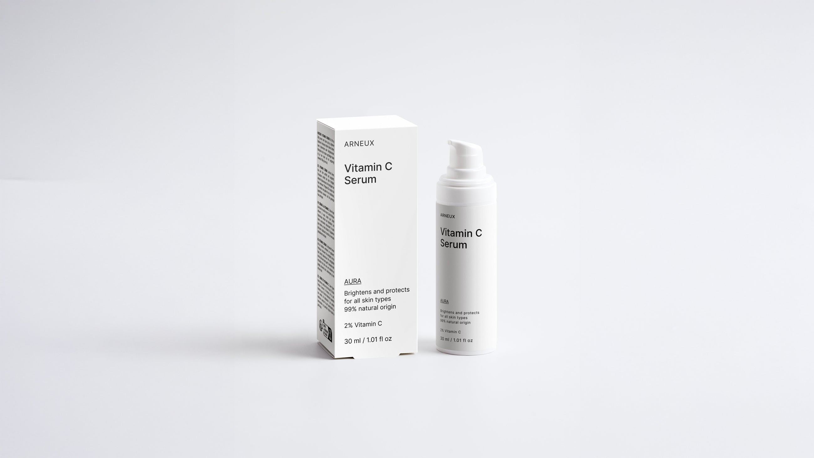 AURA vitamin C serum bottle and box packaging set on grey background