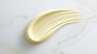 Vitamin C serum yellow-toned texture swatch on white marble, lightweight fast-absorbing consistency