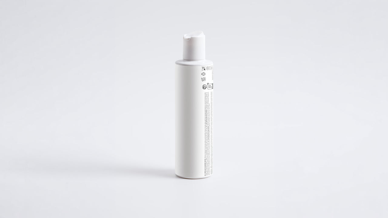 BARE micellar cleansing water slim white bottle, side profile view
