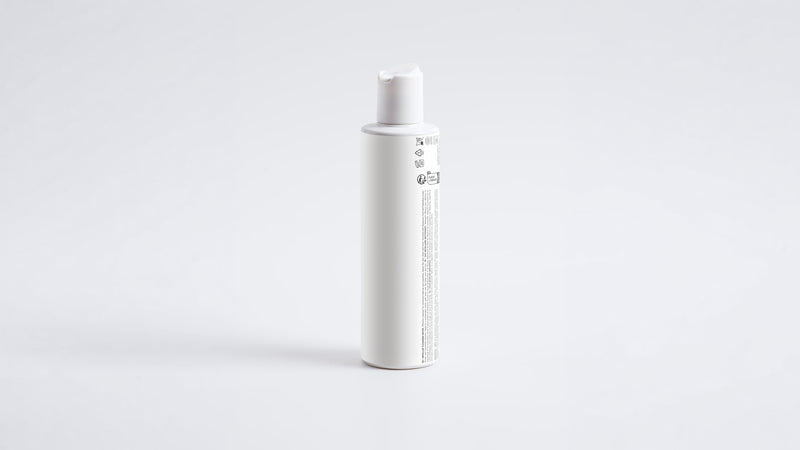BARE micellar cleansing water slim white bottle, side profile view