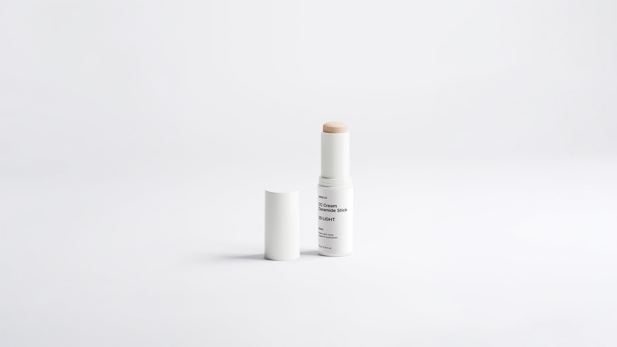 Arneux BLEND CC cream ceramide stick shade 20 Light extended with cap on grey background