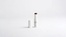 BLEND CC cream ceramide stick shade 35 Deep extended beside cap on white background