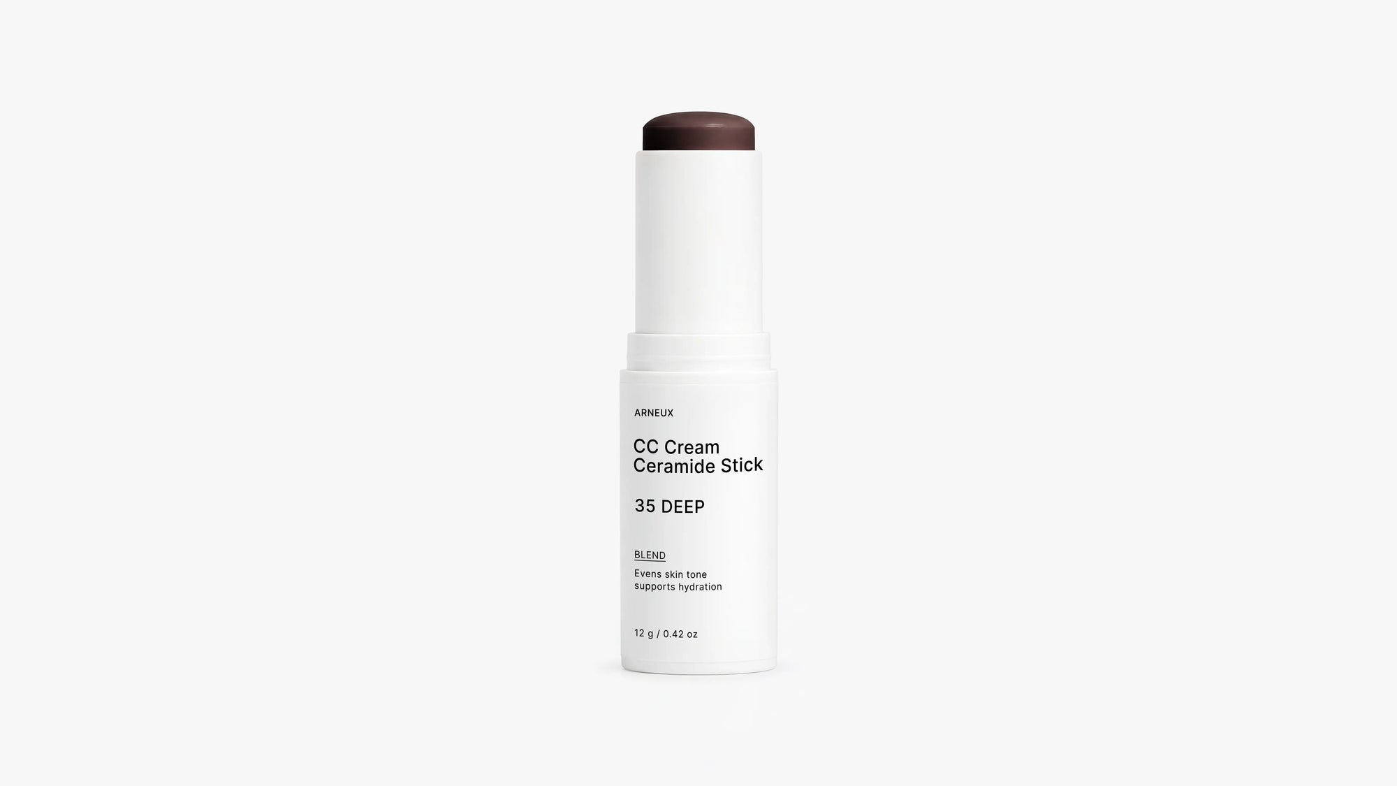 BLEND CC cream ceramide stick shade 35 Deep extended beside cap on white background