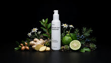 CALM moisturizer bottle with ginger, bergamot, juniper berries, argan and edelweiss on black
