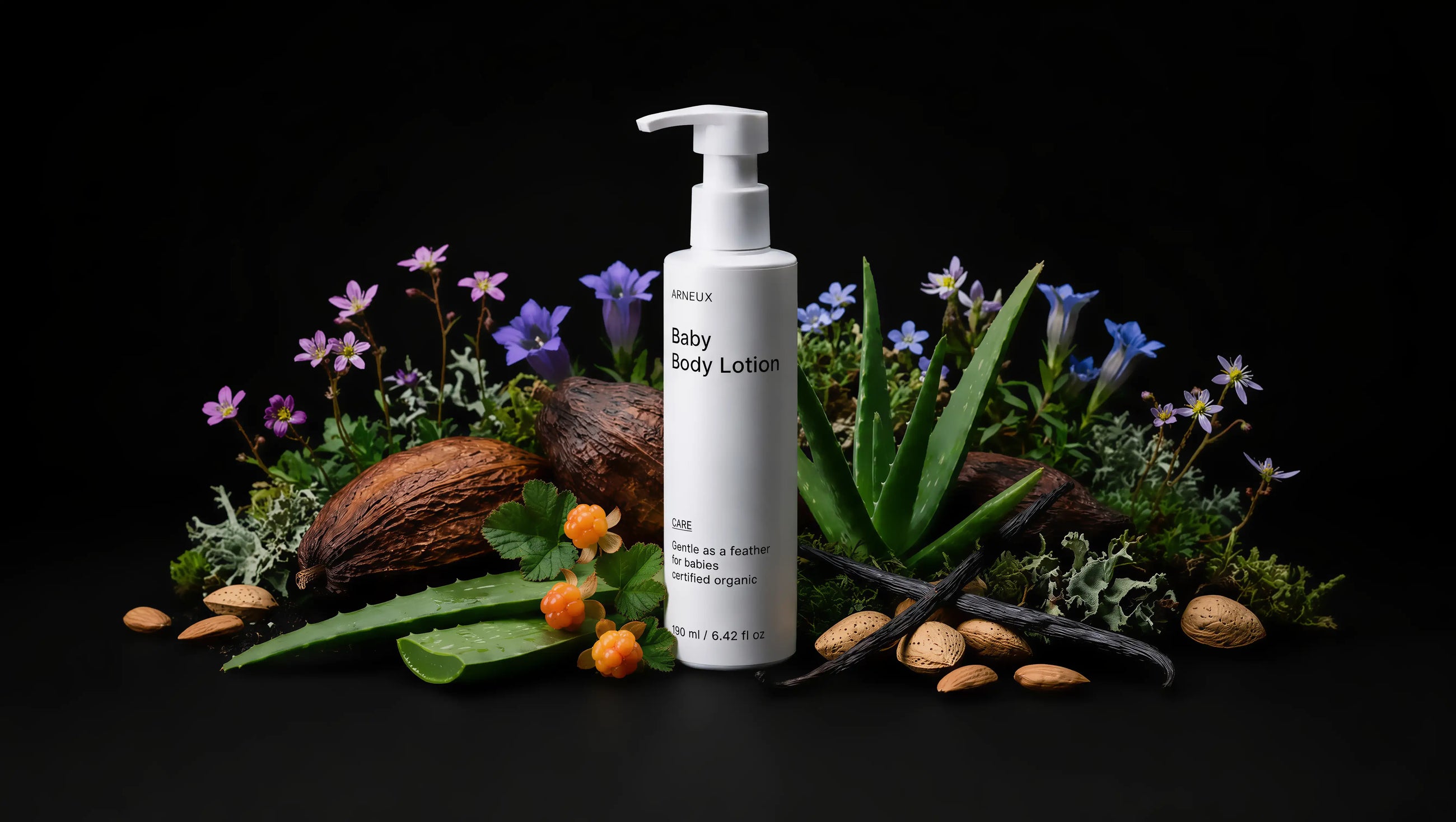 CARE baby body lotion bottle with coconut, aloe vera, purple florals and almonds on black background