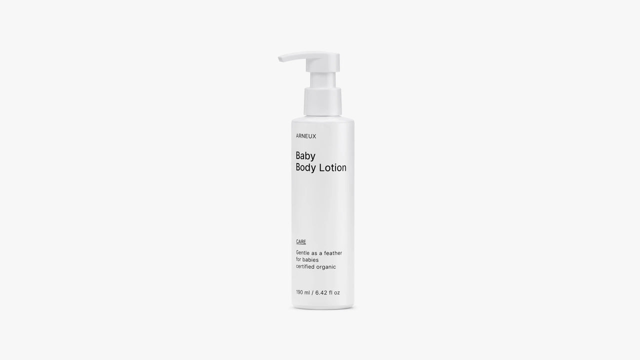 Arneux CARE baby body lotion pump bottle, front label view on light grey background