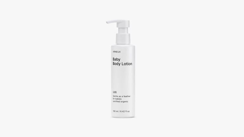 Arneux CARE baby body lotion pump bottle, front label view on light grey background