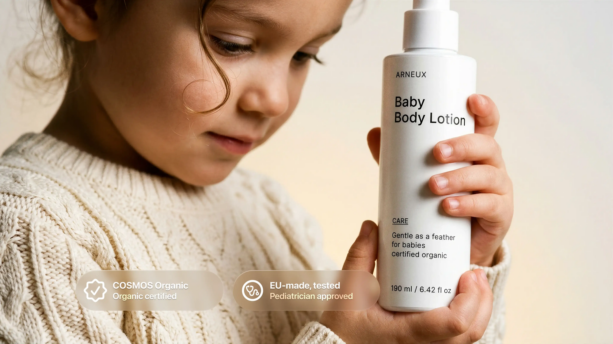 Young girl holding CARE baby body lotion, COSMOS Organic certified EU-made pediatrician approved callouts
