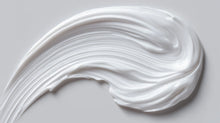CARE baby body lotion rich white cream texture swatch, fast-absorbing gentle formula close-up
