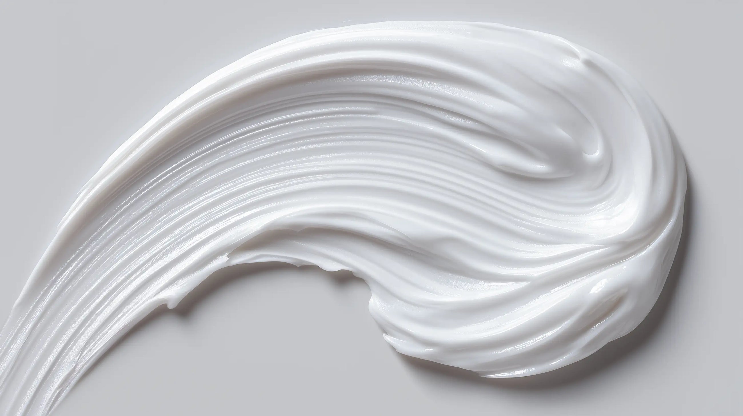 CARE baby body lotion rich white cream texture swatch, fast-absorbing gentle formula close-up