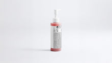 CLEANSE radiant glow facial wash bottle side view showing back label on grey background