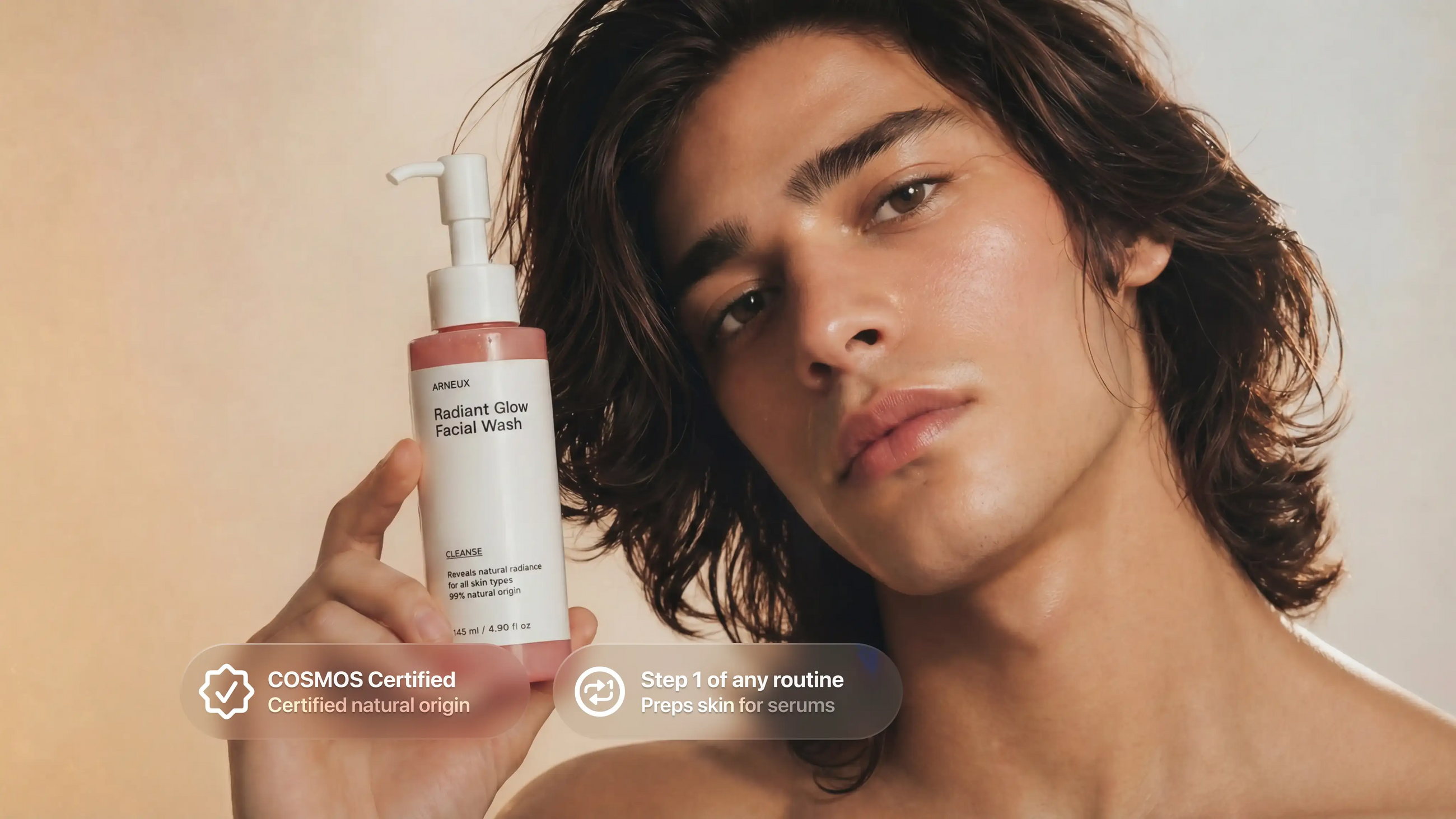 Man holding CLEANSE radiant glow facial wash, COSMOS certified step 1 of any routine callout