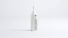 CLEAR blemish care face wash pump bottle, side profile view on grey background