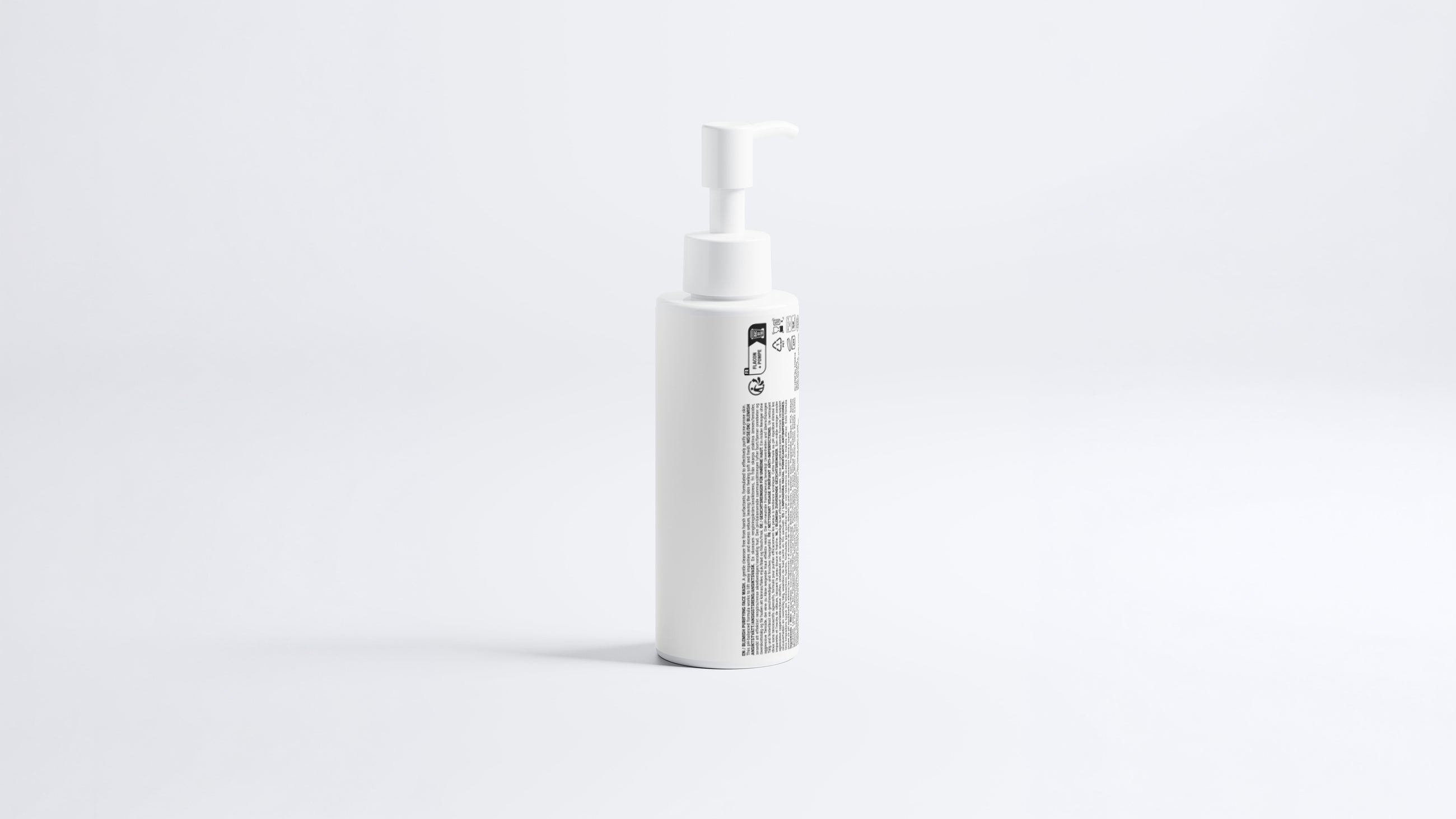 CLEAR blemish care face wash pump bottle, side profile view on grey background