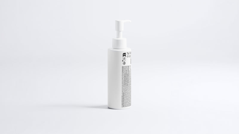 CLEAR blemish care face wash pump bottle, side profile view on grey background