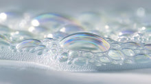 Iridescent soap bubbles and cloud foam texture close-up, gentle no-rub formula from CLOUD baby wash