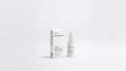 CORRECT dark spot care bottle and box packaging set on grey background