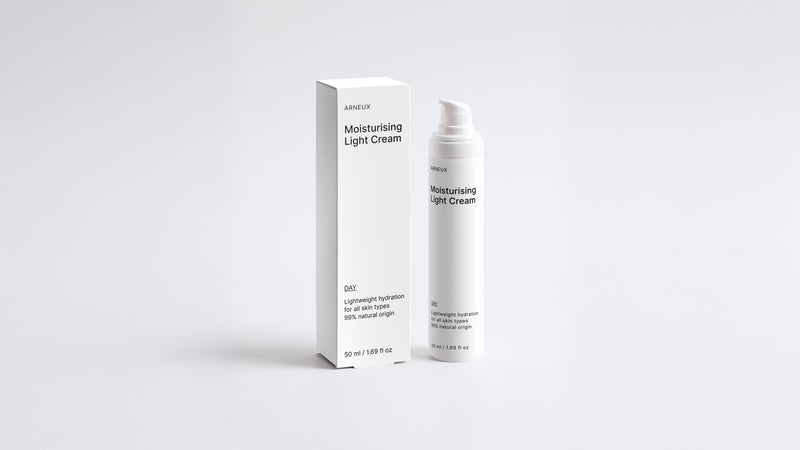 DAY moisturizing light cream bottle and box packaging set on grey background