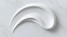 Moisturizing light cream smooth white texture swatch on marble, fast-absorbing matte finish consistency