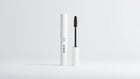 Arneux DEFINE lengthening volumizing mascara white tube with black wand extended on grey background