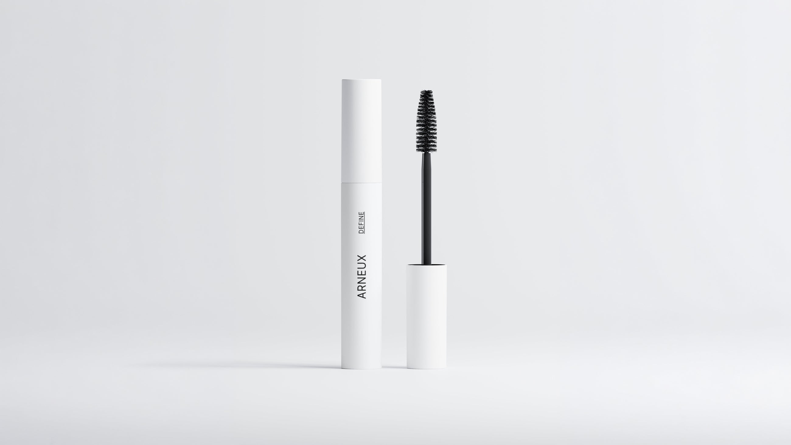Arneux DEFINE lengthening volumizing mascara white tube with black wand extended on grey background