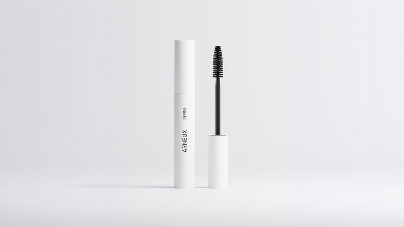 Arneux DEFINE lengthening volumizing mascara white tube with black wand extended on grey background