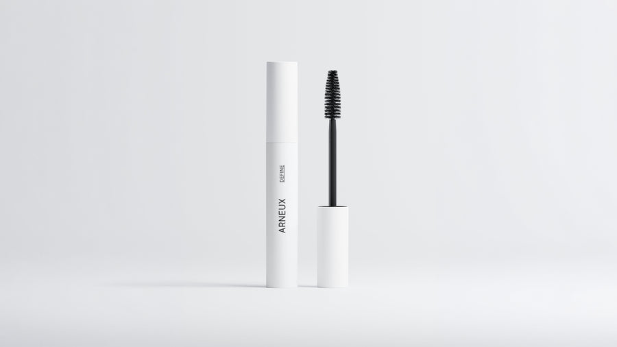 Arneux DEFINE lengthening volumizing mascara white tube with black wand extended on grey background