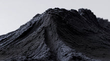 Mound of fine black charcoal mineral powder, natural pigment ingredient in DEFINE mascara