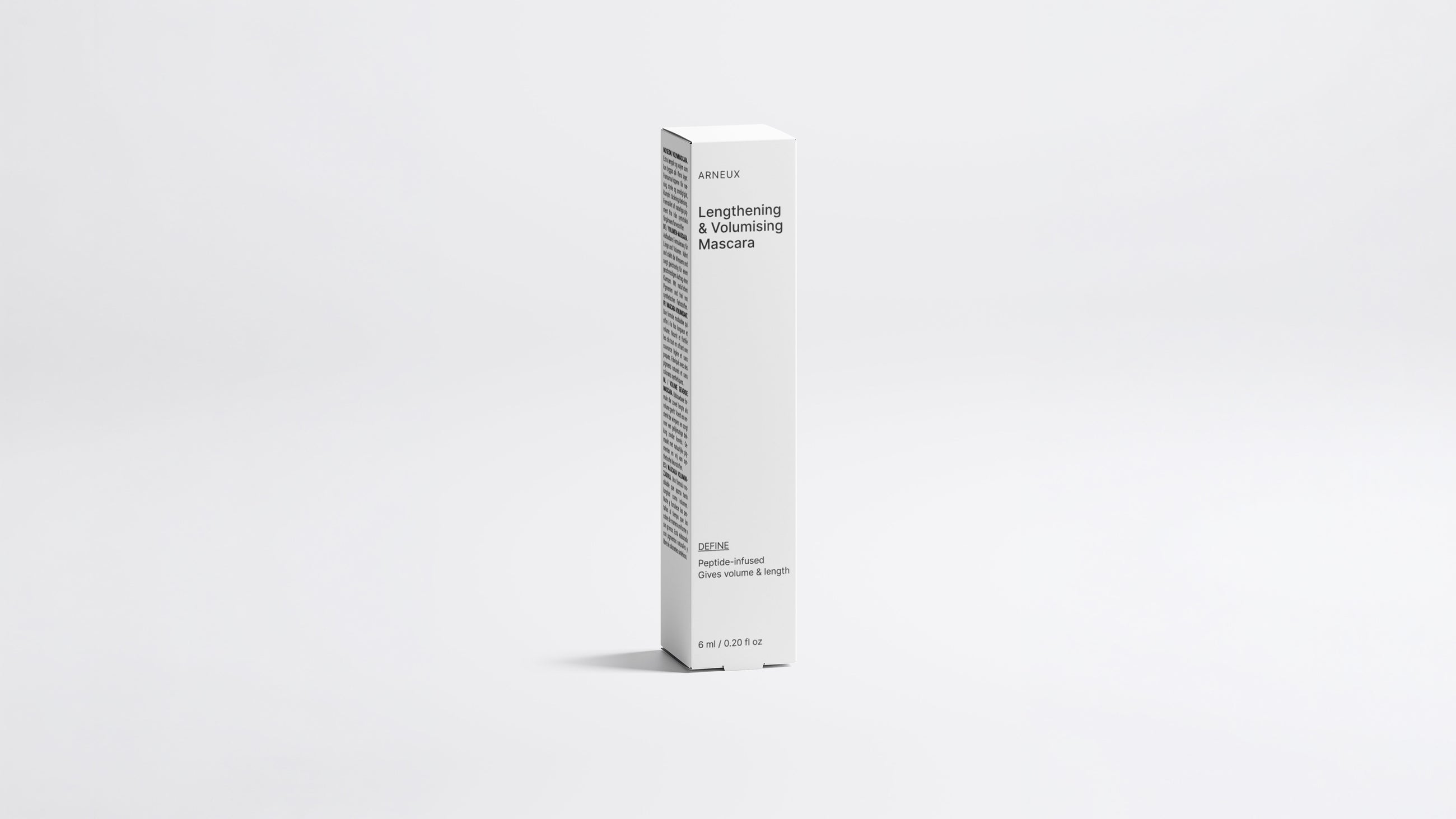 DEFINE lengthening volumizing mascara tube and box packaging set on white background