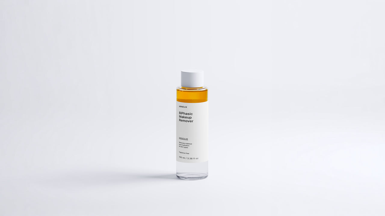 Arneux DISSOLVE biphasic makeup remover bottle showing amber dual-phase formula, front label