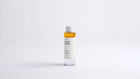 Arneux DISSOLVE biphasic makeup remover bottle showing amber dual-phase formula, front label