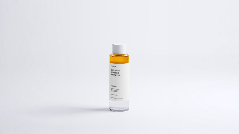 Arneux DISSOLVE biphasic makeup remover bottle showing amber dual-phase formula, front label