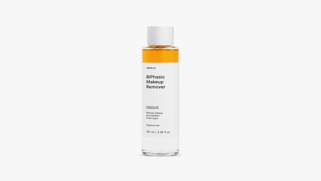 Arneux DISSOLVE biphasic makeup remover bottle showing amber dual-phase formula, front label
