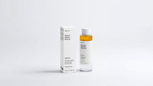 DISSOLVE biphasic makeup remover bottle and box packaging, full product set on grey background